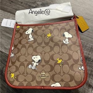 NWT Coach Peanuts Dempsey File Bag in signature canvas with Snoopy and Woodstock